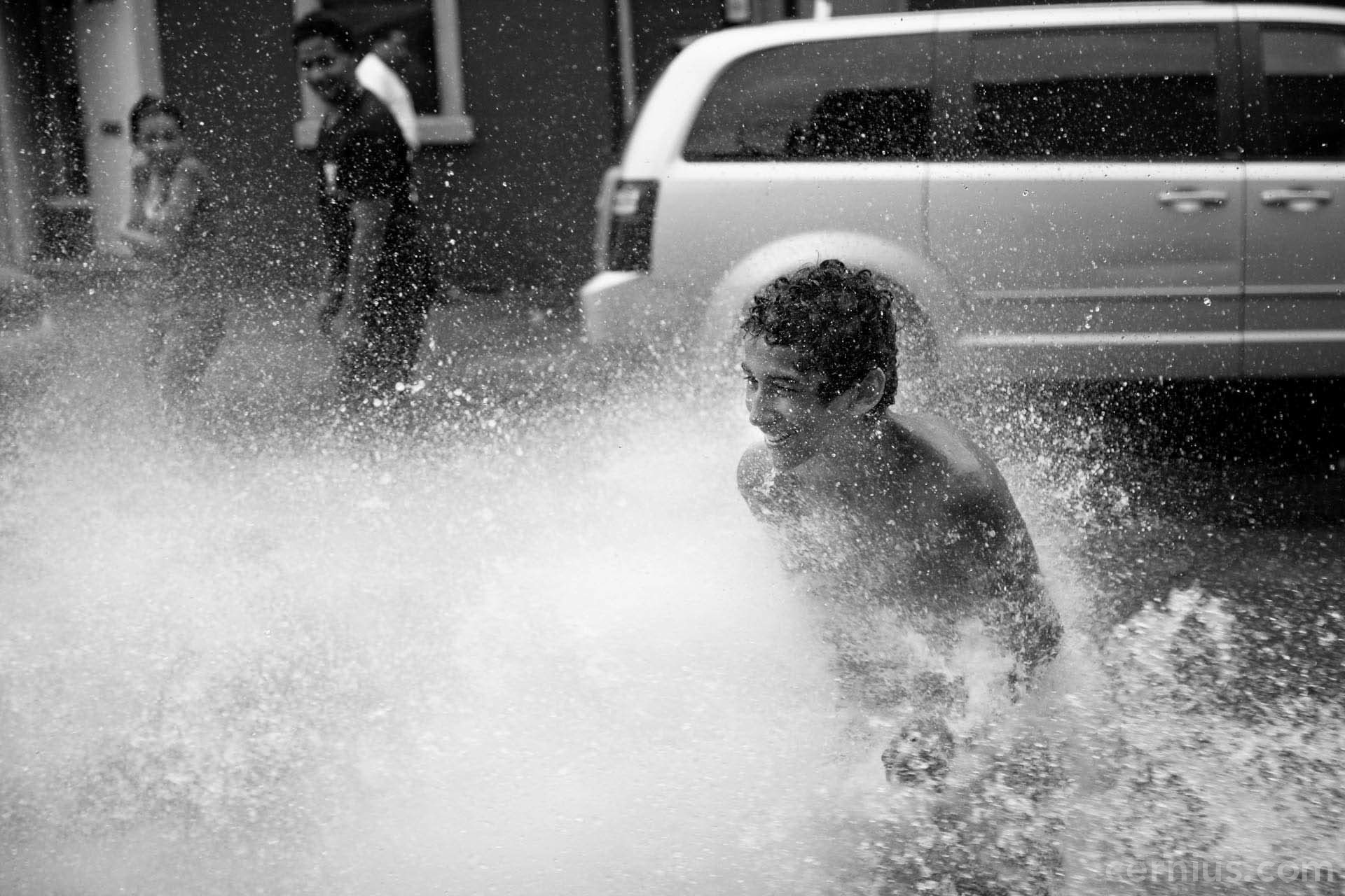 Kids playing in a fire hydrant in Bushwick, Brooklyn | Juozas Cernius